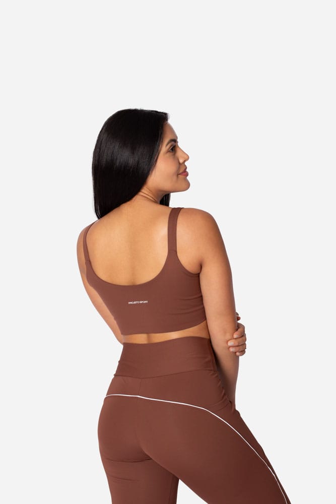 Legging marrom com bolso lateral e viés branco